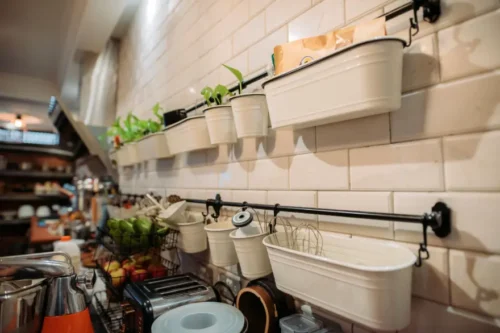 Aluminium rack hanging on the wall for kitchen cooking utensils storage